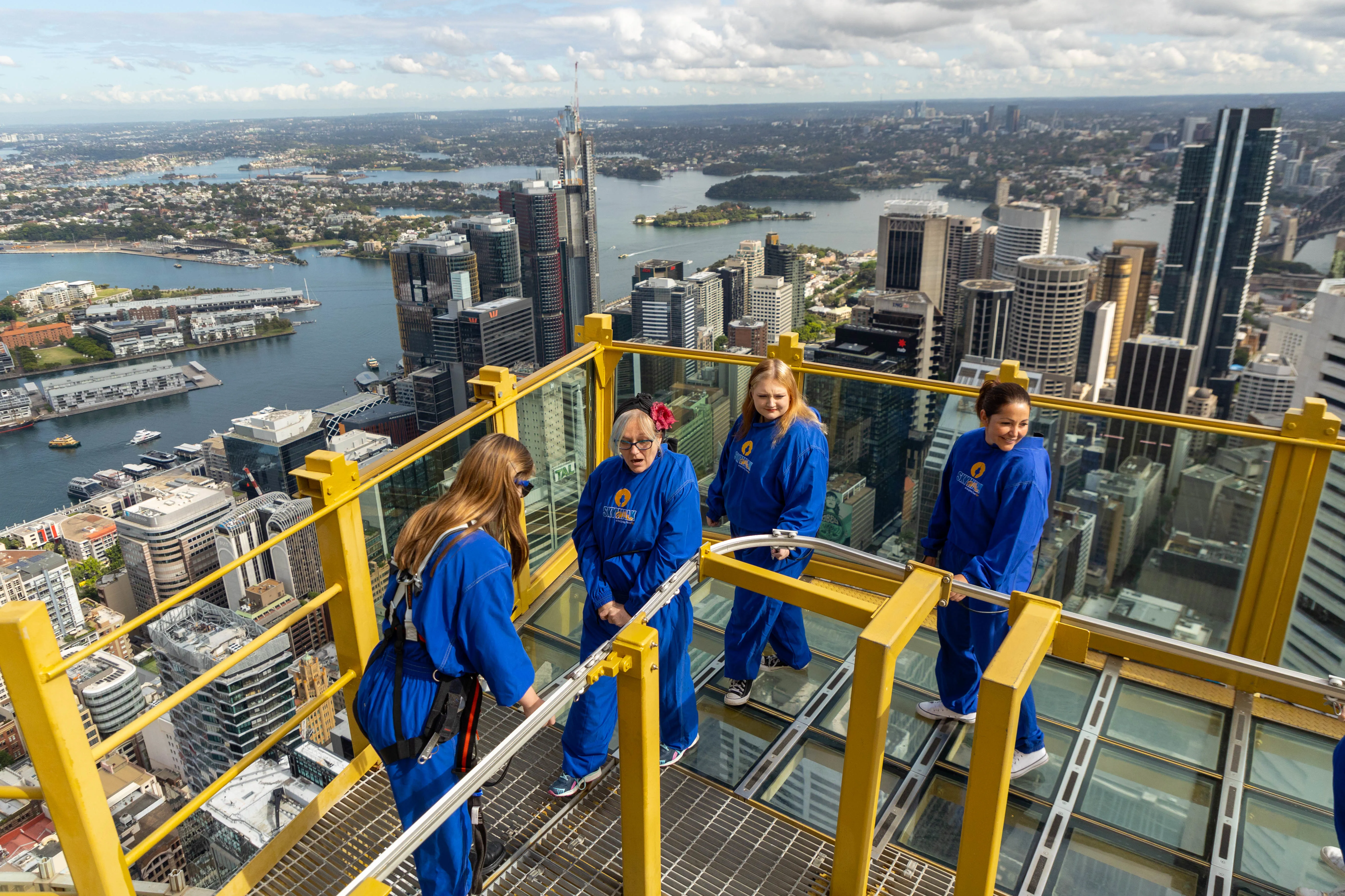 SKYWALK Guide Liv Robertson Assists Mother And Daughter Duo Alongside Gemma On SKYWALK