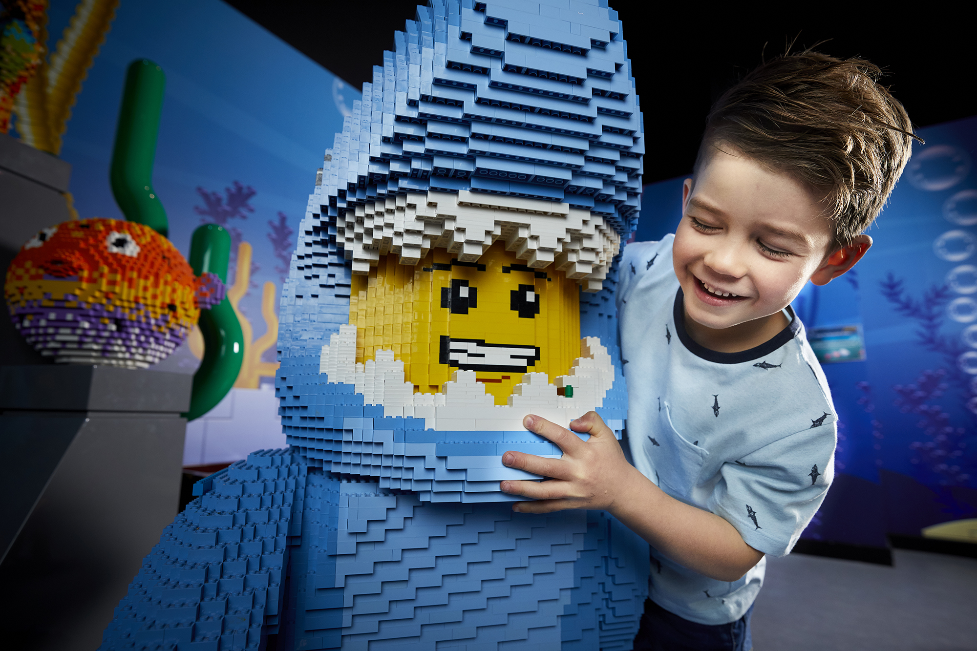 child with lego figure