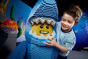 child with lego figure